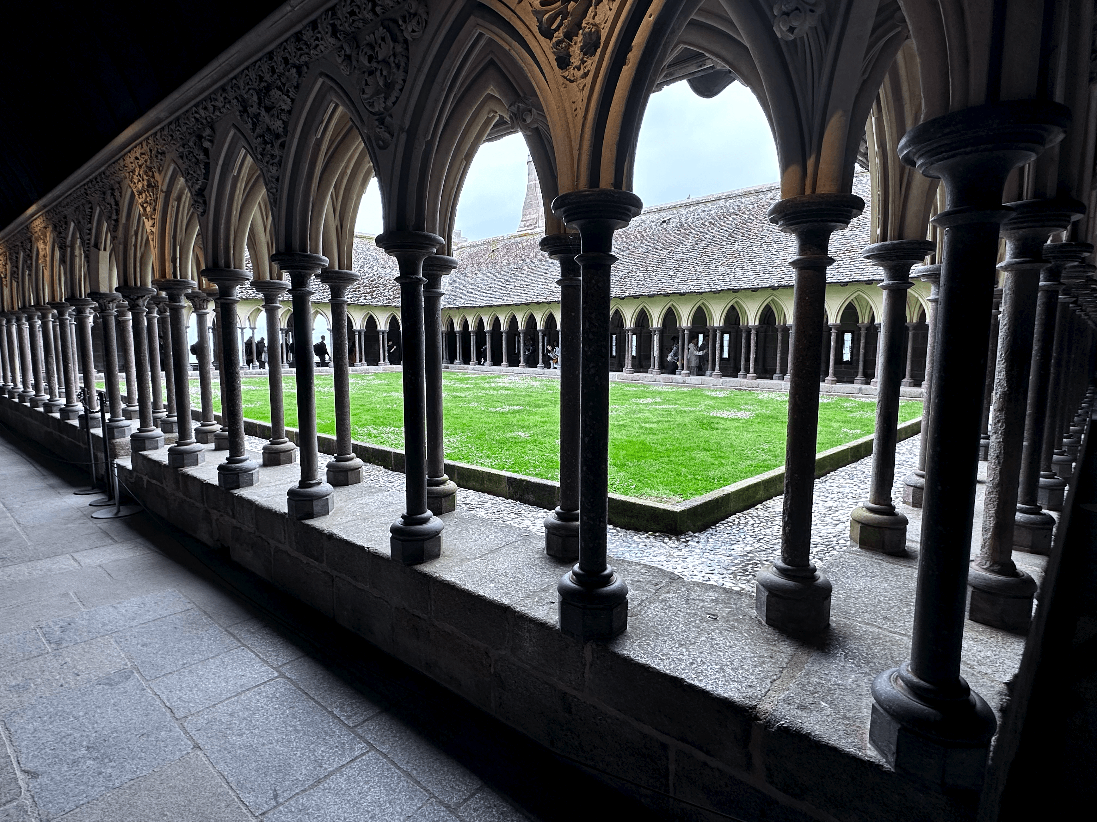 Green monk's garden inside the cloister at Mont Saint-Michel abbey