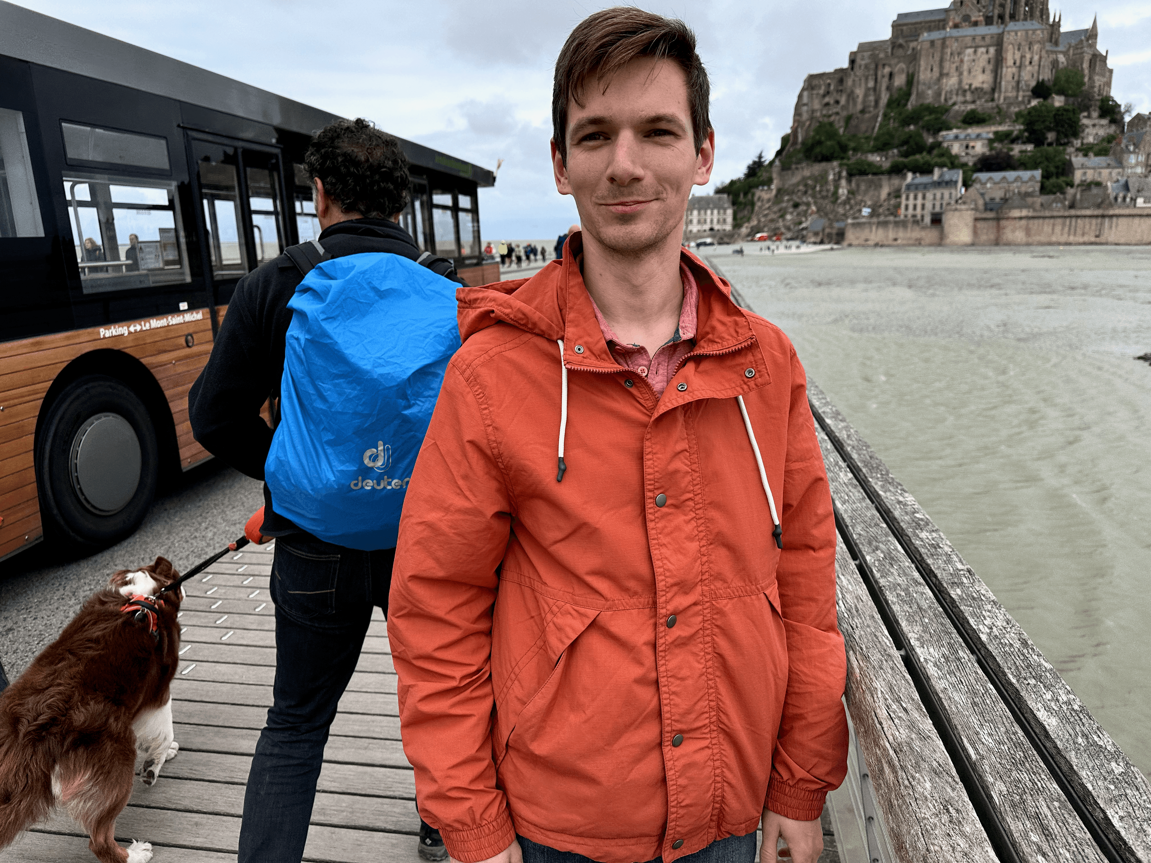 Posing in front of Mont Saint-Michel when a dog walked by and stole attention