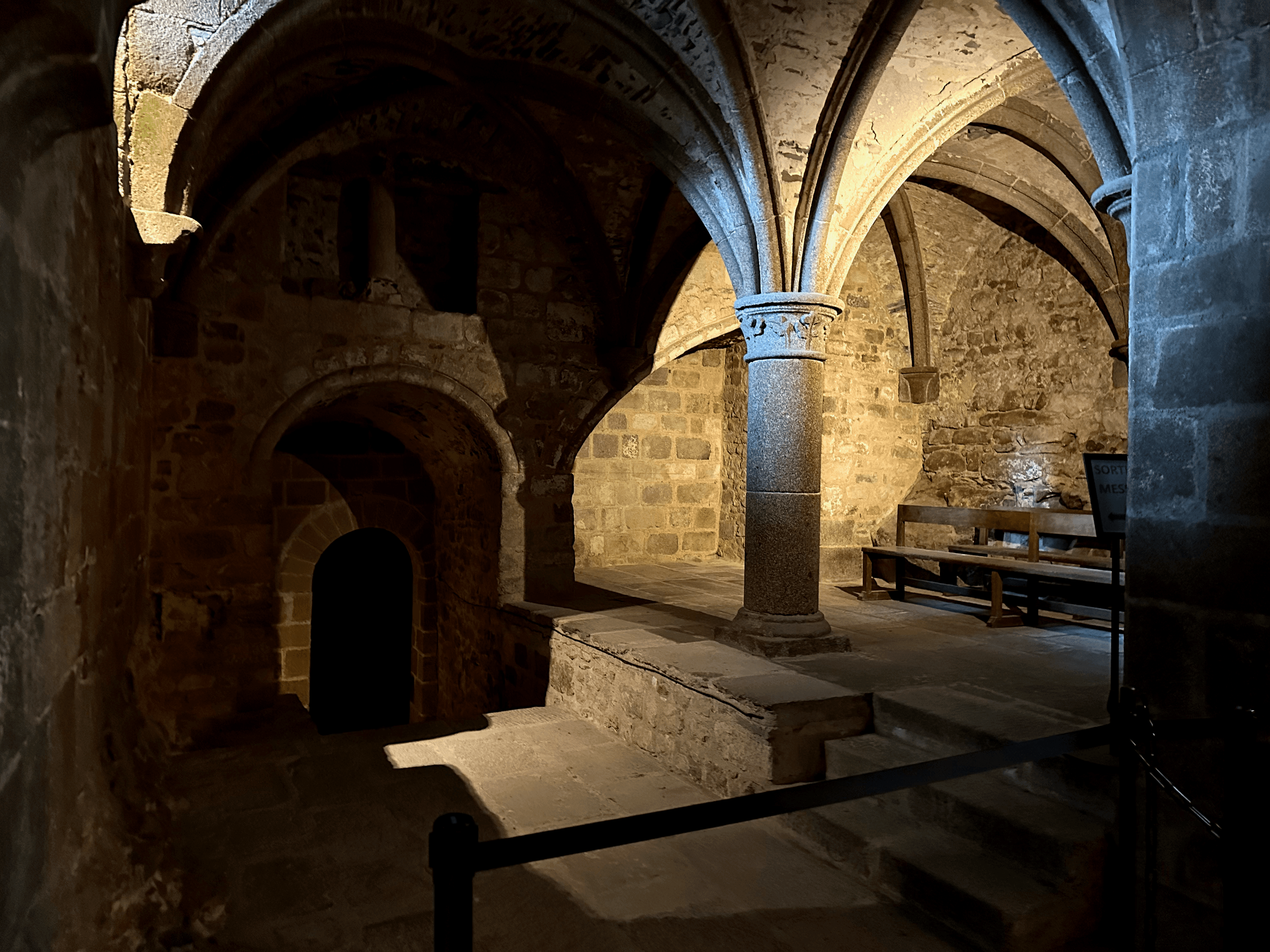 Stone hallway, stairs, and arches inside the abbey of Mont Saint-Michel
