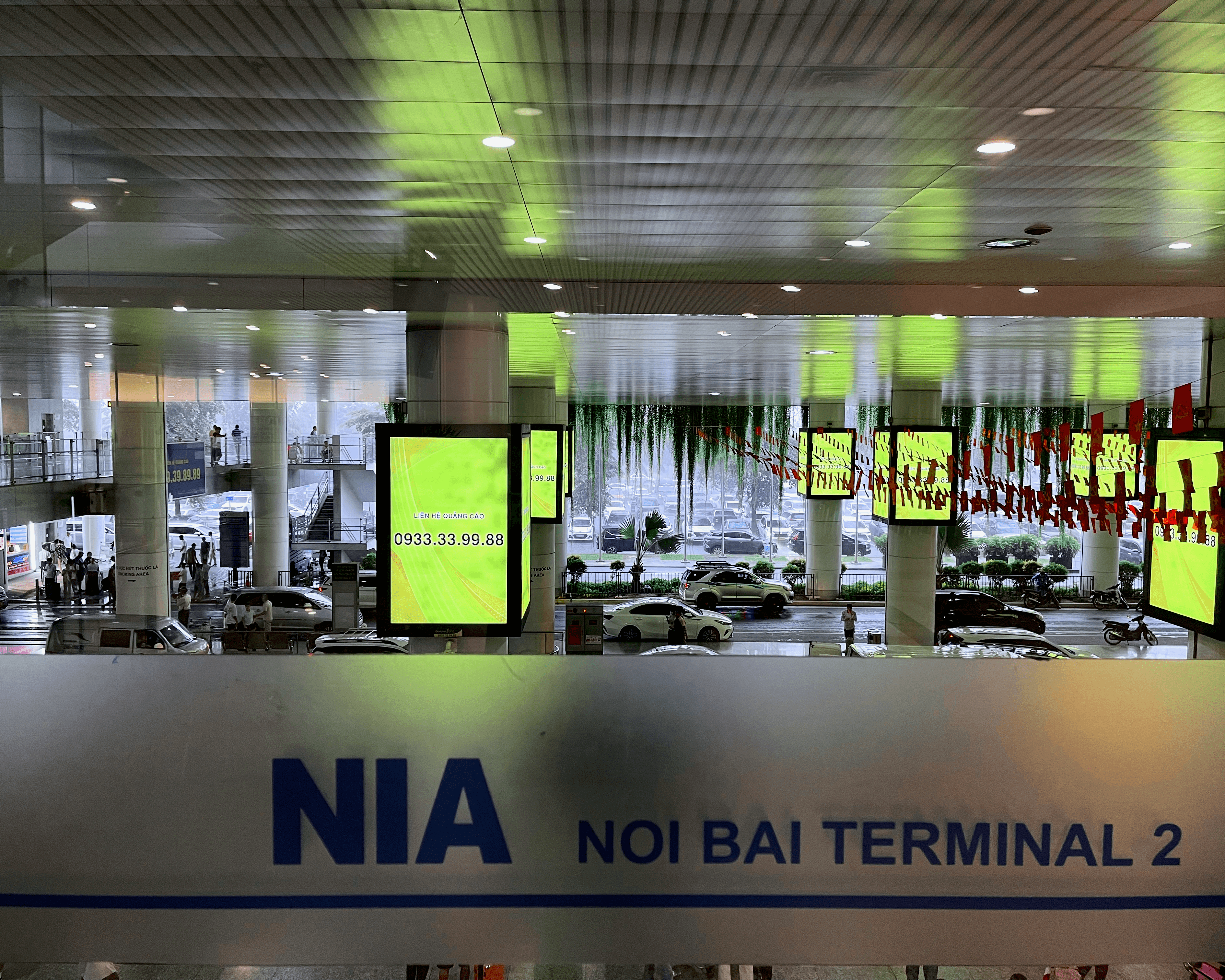 Rainy scene outside Noi Bai Terminal 2 in Vietnam
