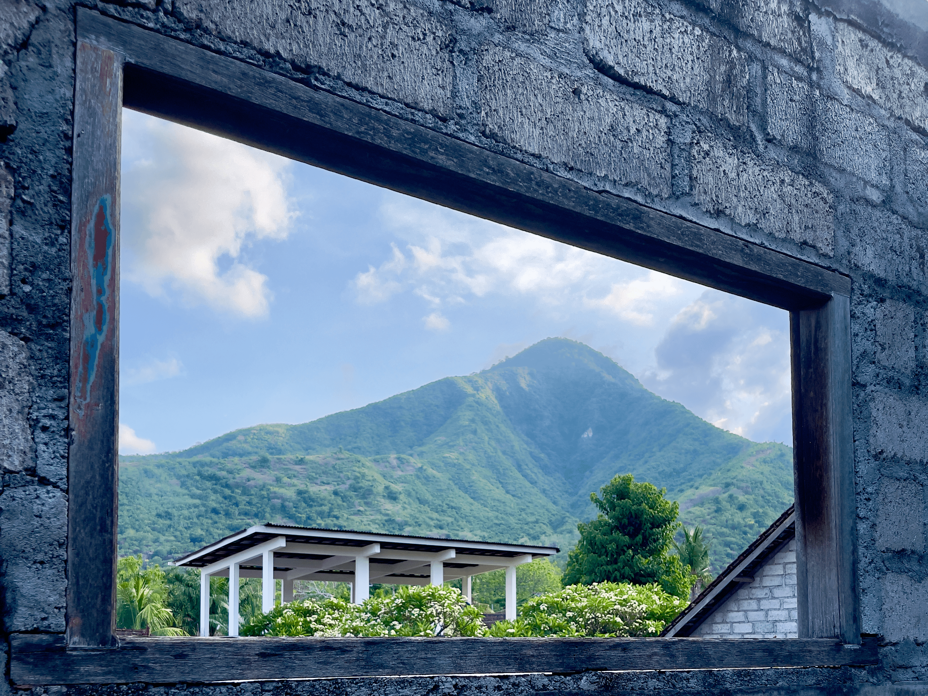 View of a mountain and valley through a window in Bali, Indonesia