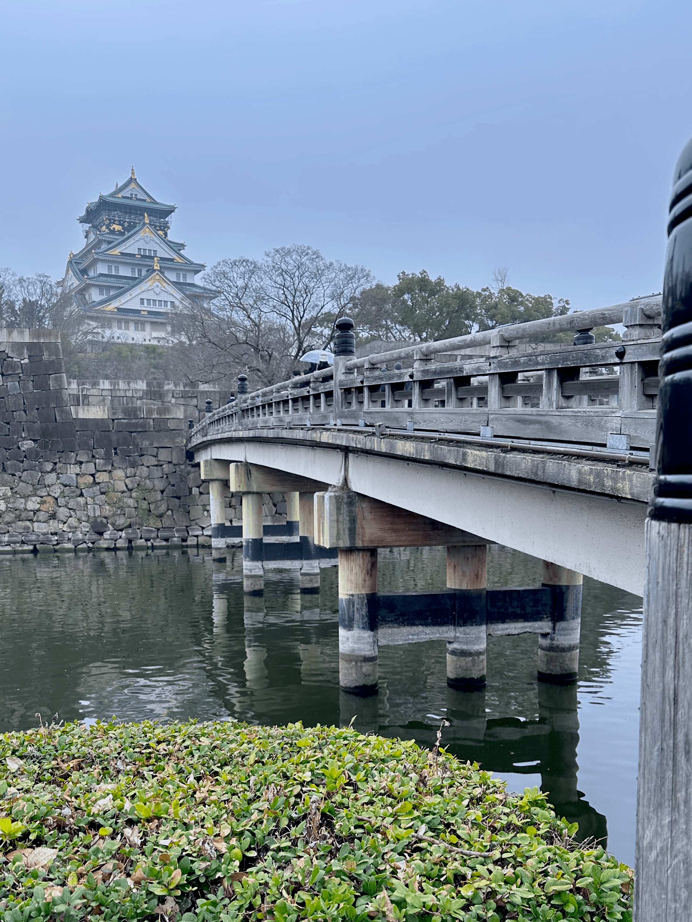 Osaka Castle with bridge and moat in Osaka, Japan